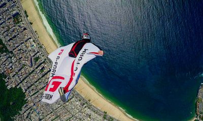 Jamie Flynn flys past Christ The Redeemer in a wingsuit